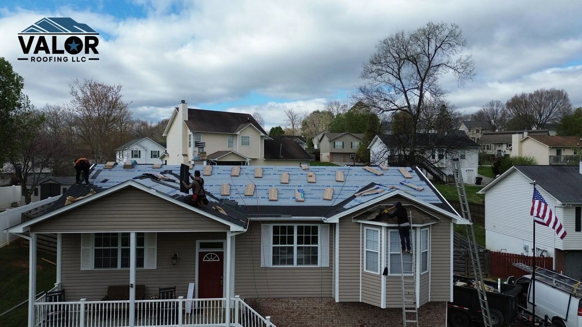 Valor Roofing crew working on a home's roof in East Tennessee